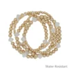 Water Resistant Set Of 5 Gold Textured Beaded & White Clover Stretch Bracelets What's Hot Jewelry
